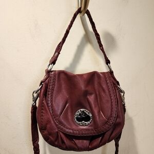 Lucky Brand burgundy red leather braided strap flap purse with a heart closure